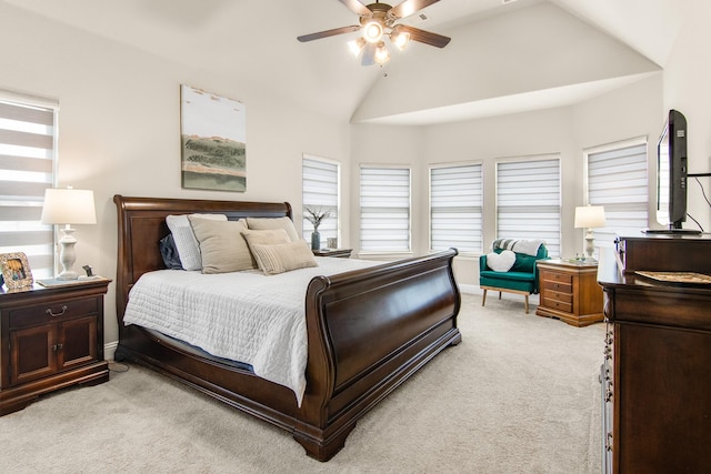 bedroom featuring lofted ceiling, ceiling fan, baseboards, and light colored carpet