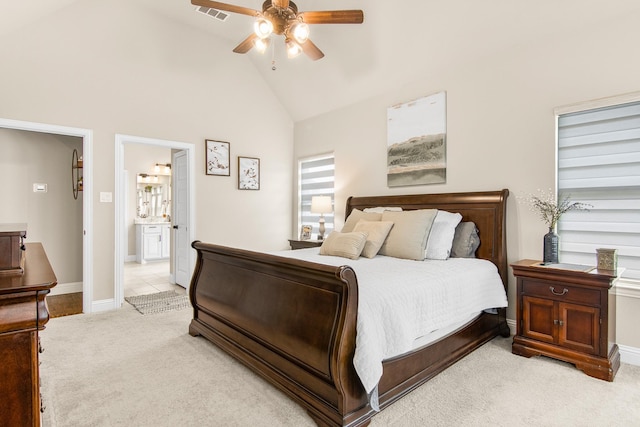 bedroom featuring light carpet, visible vents, baseboards, ceiling fan, and high vaulted ceiling