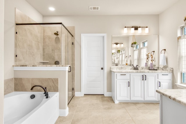 bathroom featuring visible vents, a shower stall, vanity, and a bath