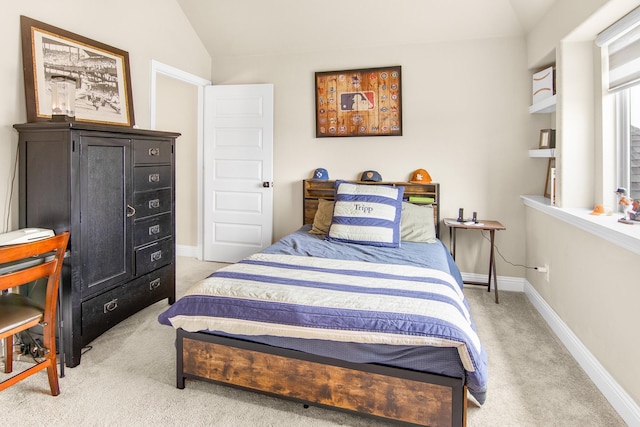 bedroom featuring vaulted ceiling, carpet flooring, and baseboards