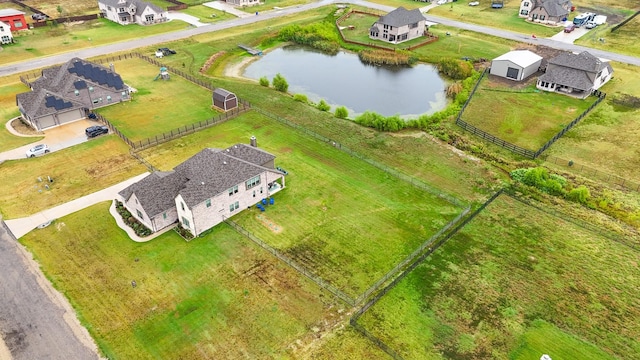 aerial view featuring a water view and a residential view