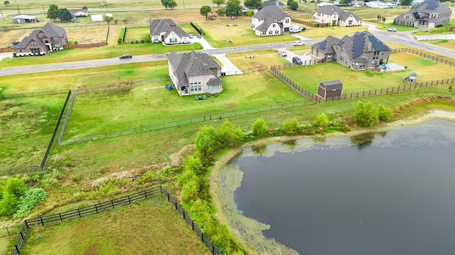 aerial view with a residential view, a water view, and a rural view