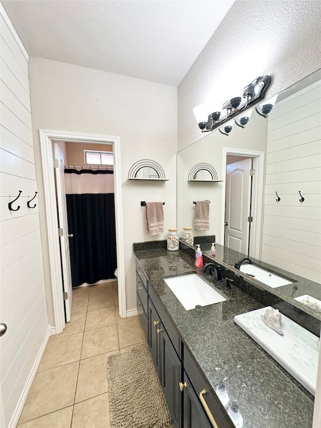 bathroom with a shower with shower curtain, toilet, tile patterned flooring, a textured ceiling, and vanity