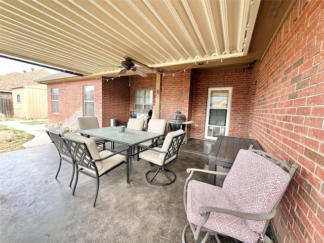 view of patio / terrace featuring a ceiling fan, outdoor dining space, and area for grilling