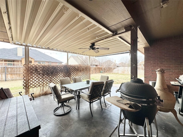 view of patio / terrace featuring a grill, outdoor dining area, a fenced backyard, and ceiling fan