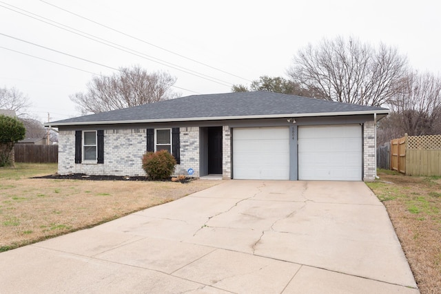 ranch-style house with a garage, brick siding, fence, concrete driveway, and a front yard