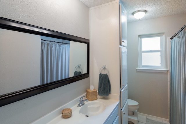 full bathroom with a textured ceiling, curtained shower, vanity, and toilet