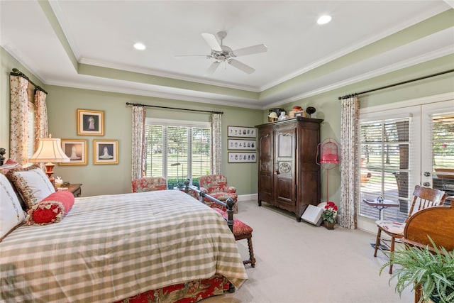 bedroom featuring ornamental molding, recessed lighting, a raised ceiling, and light carpet