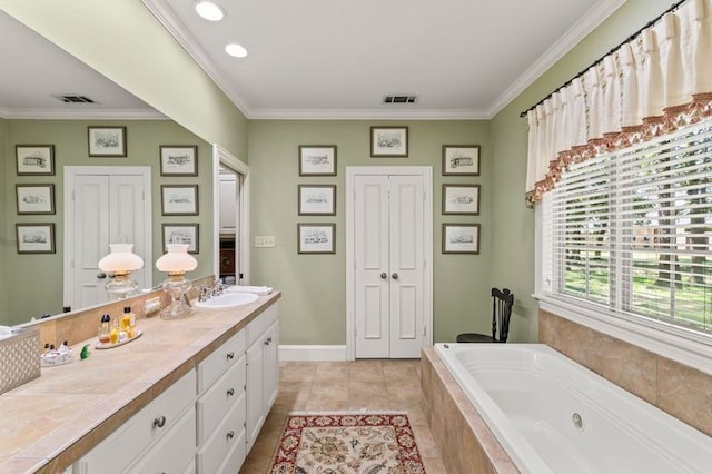 bathroom with a whirlpool tub, visible vents, crown molding, and tile patterned floors