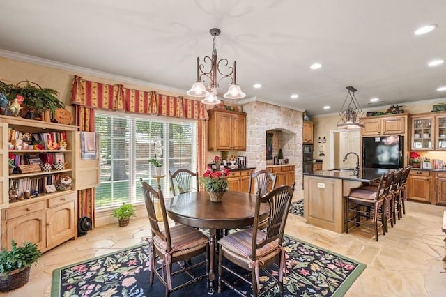 dining area with a notable chandelier, ornamental molding, stone finish floor, and recessed lighting