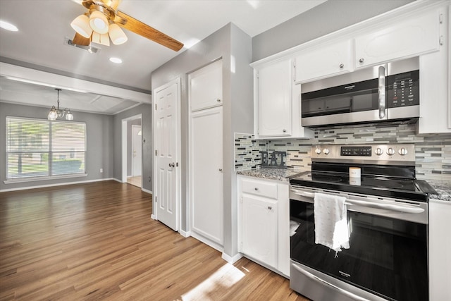 1803 Burr Oak St, Arlington, TX 76012 - kitchen with stainless steel appliances, tasteful backsplash, white cabinetry, light wood-style floors, and recessed lighting