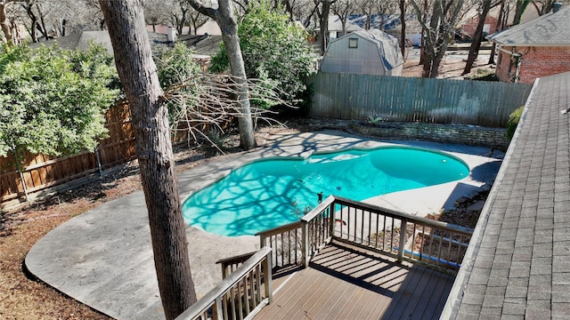 view of swimming pool featuring a fenced backyard and a fenced in pool