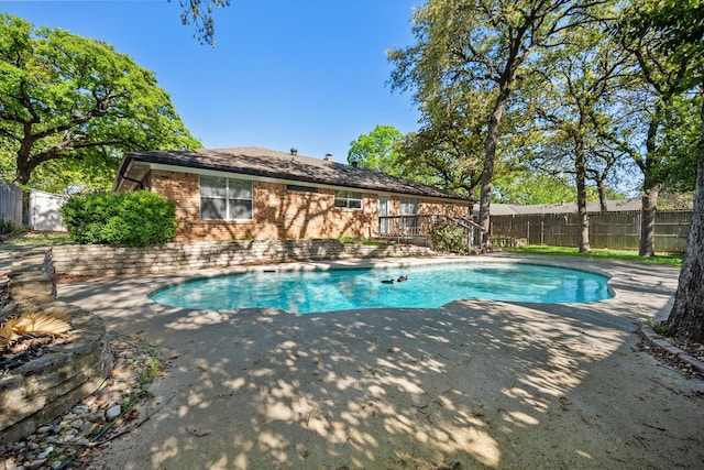 1803 Burr Oak St, Arlington, TX 76012 - view of swimming pool featuring a patio, a fenced backyard, and a deck