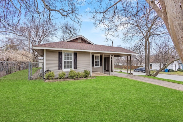 view of front of house with a carport, a front yard, fence, and driveway