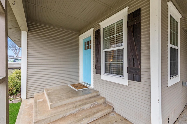 property entrance featuring covered porch