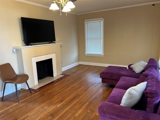 living room featuring ornamental molding, wood-type flooring, a fireplace with flush hearth, and baseboards