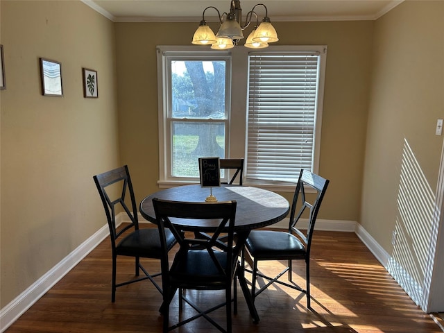 dining space with dark wood-style floors, baseboards, and ornamental molding