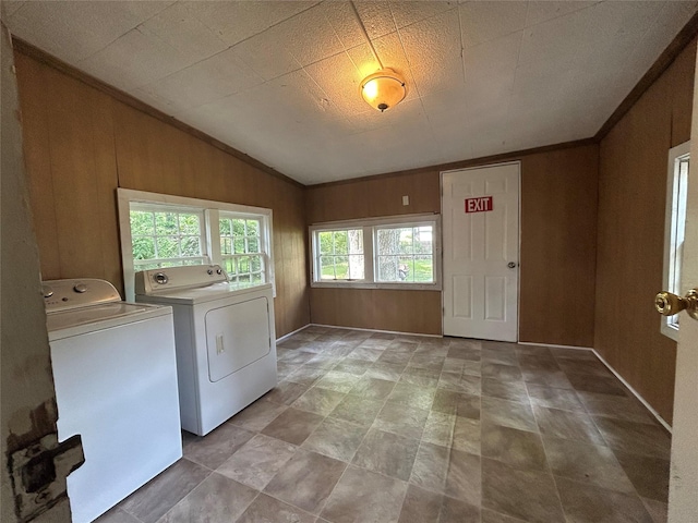 4436 Clingman Dr, Shreveport, LA 71105 - washroom featuring separate washer and dryer and wooden walls