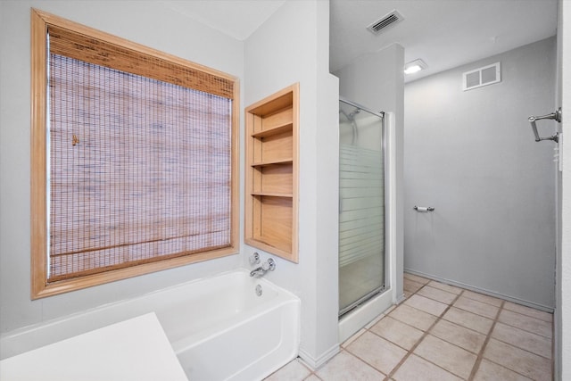 full bath featuring a stall shower, a garden tub, and visible vents