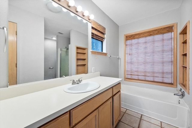 149 Lakeview Dr, Streetman, TX 75859 - bathroom with tile patterned floors, vanity, a bath, and a shower stall