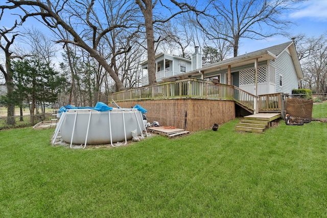 149 Lakeview Dr, Streetman, TX 75859 - view of yard featuring fence, an outdoor pool, and a deck