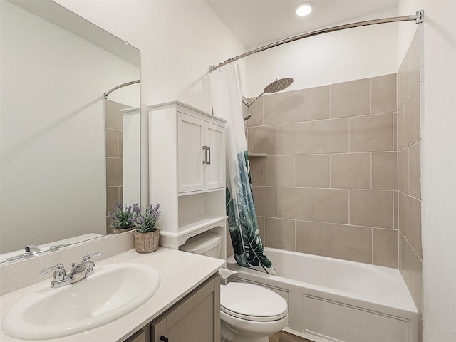 full bathroom with toilet, shower / bath combo with shower curtain, and vanity