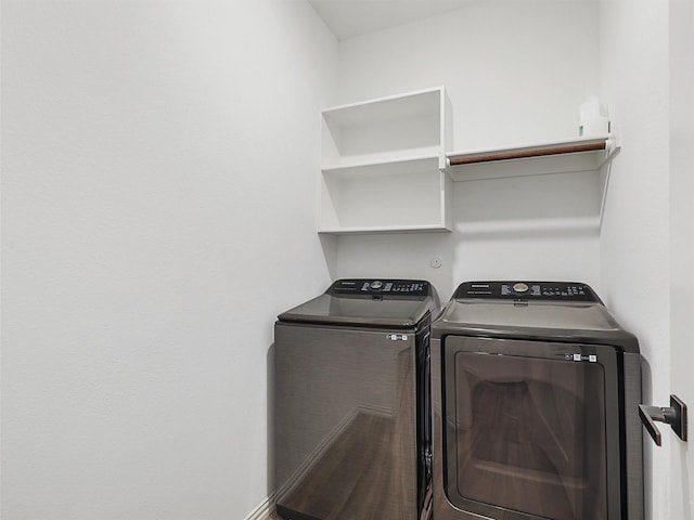 laundry area with washing machine and dryer and laundry area