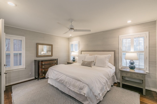 bedroom featuring crown molding, recessed lighting, ceiling fan, wood finished floors, and baseboards