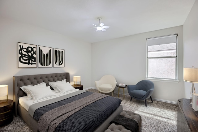 bedroom with a ceiling fan, carpet flooring, and baseboards