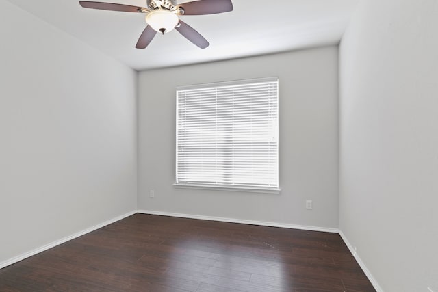 unfurnished room featuring ceiling fan, baseboards, and wood finished floors