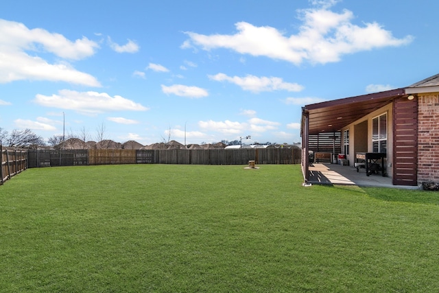 view of yard featuring a patio and a fenced backyard