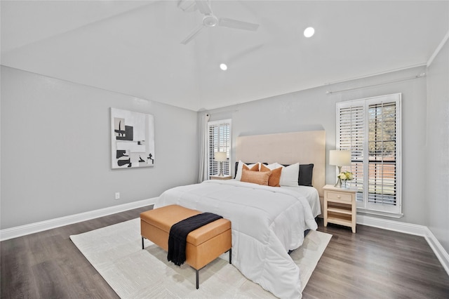 bedroom featuring lofted ceiling, ceiling fan, baseboards, and wood finished floors