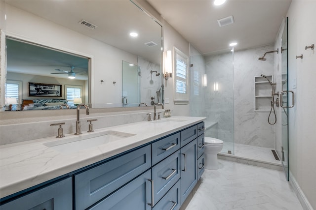 full bathroom with a marble finish shower, visible vents, and a sink