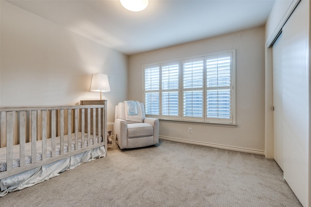 bedroom featuring carpet floors and baseboards