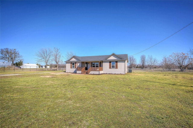 view of front of house featuring a front yard and fence