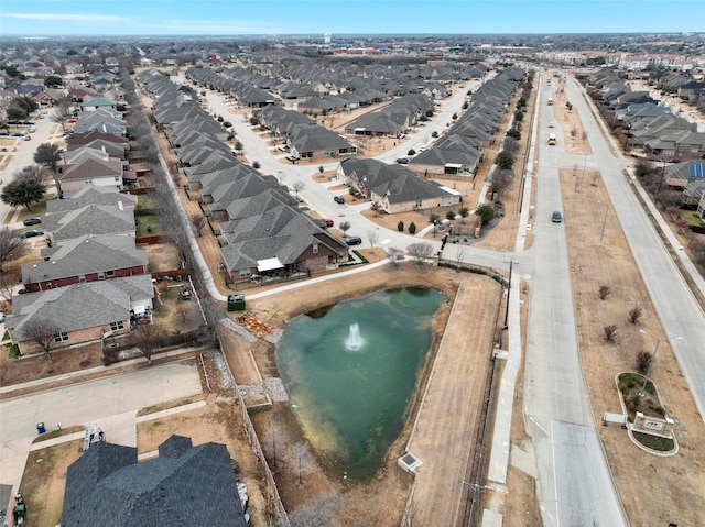 bird's eye view featuring a residential view and a water view