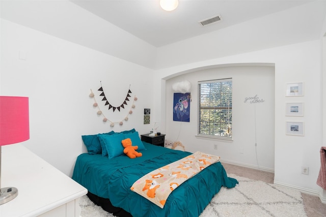 bedroom featuring baseboards, visible vents, and carpet flooring