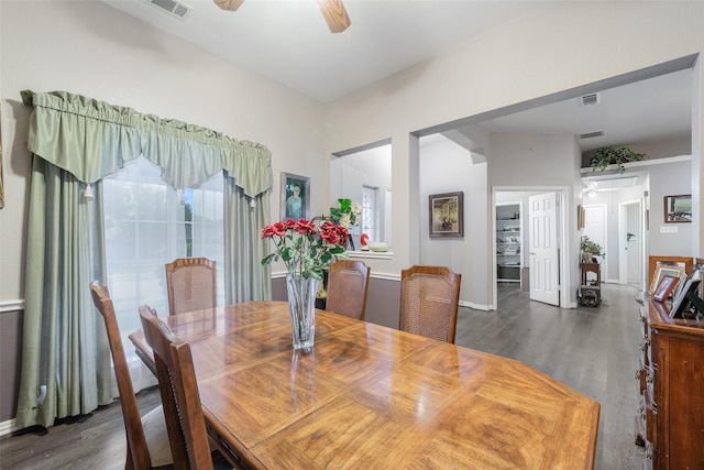 dining space with attic access, baseboards, visible vents, ceiling fan, and wood finished floors