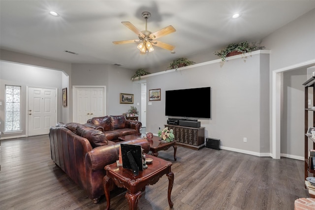 living area with arched walkways, recessed lighting, wood finished floors, a ceiling fan, and visible vents