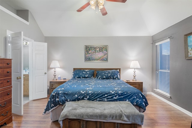 bedroom with lofted ceiling, ceiling fan, baseboards, and wood finished floors