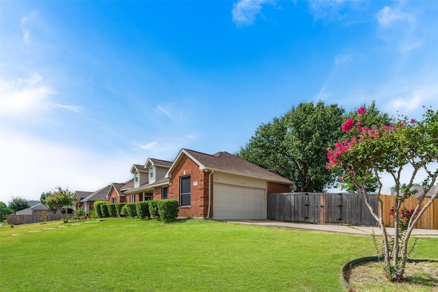 view of home's exterior with brick siding, a lawn, an attached garage, and fence