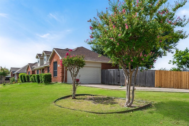 view of front of home with an attached garage, a front yard, fence, and brick siding