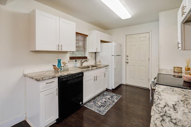 kitchen featuring black dishwasher, white cabinets, dark wood finished floors, light stone countertops, and a sink