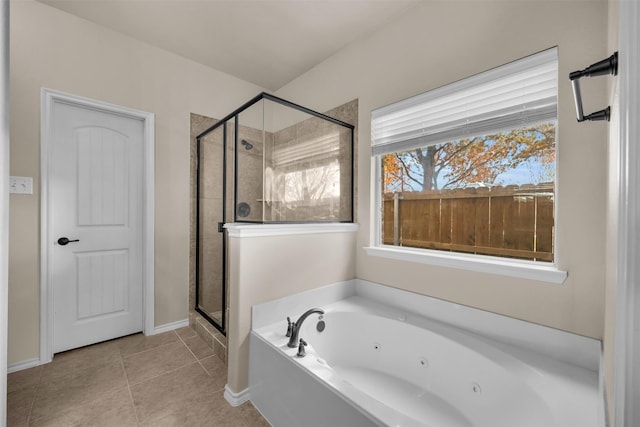 full bath featuring a stall shower, tile patterned flooring, and a tub with jets