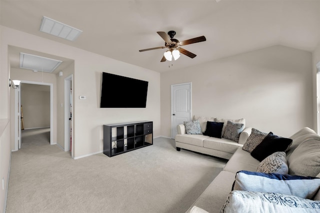 carpeted living area with visible vents, baseboards, vaulted ceiling, a ceiling fan, and attic access