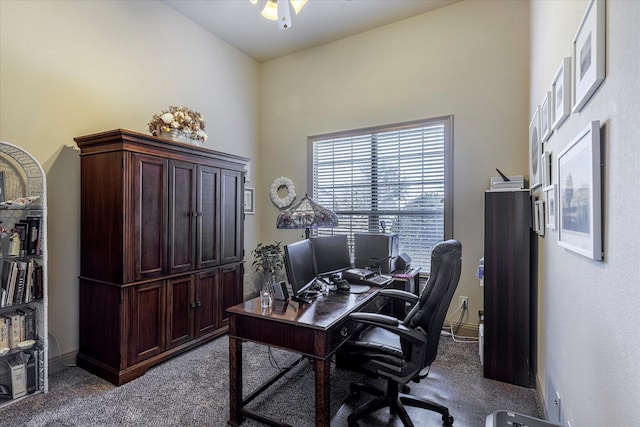 carpeted home office featuring baseboards