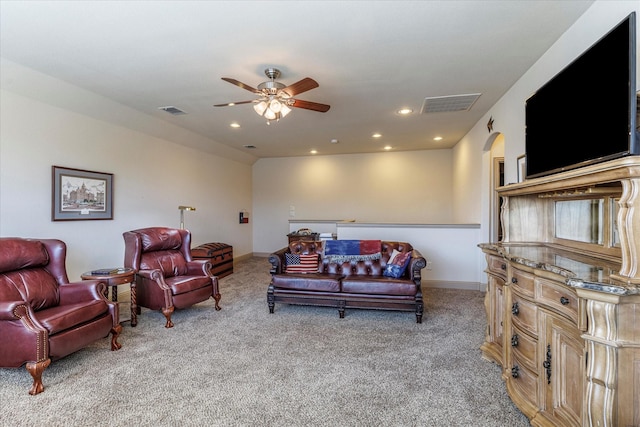 living area featuring light carpet, ceiling fan, visible vents, and recessed lighting