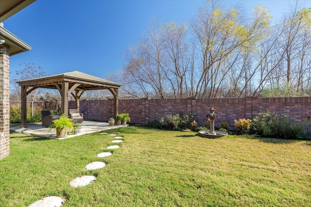 view of yard with a gazebo, a patio area, and fence