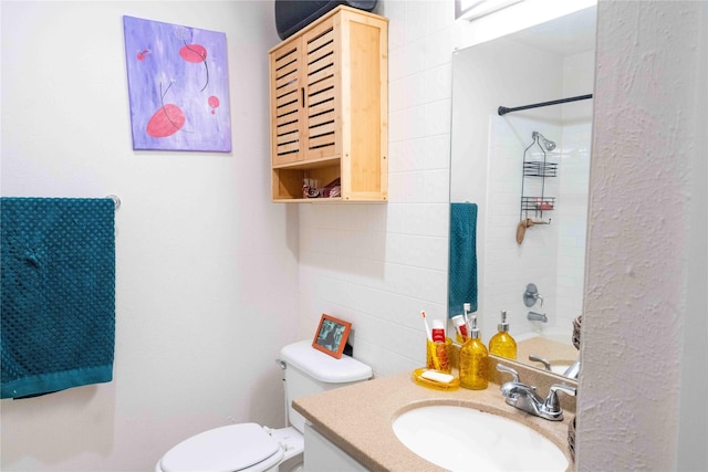 bathroom featuring toilet and vanity