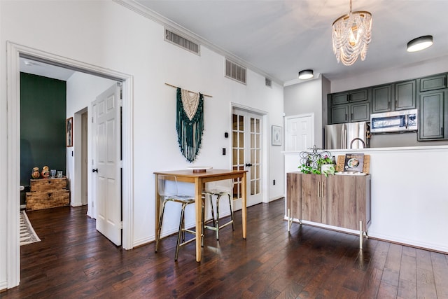 kitchen with visible vents, appliances with stainless steel finishes, dark wood-style flooring, and french doors